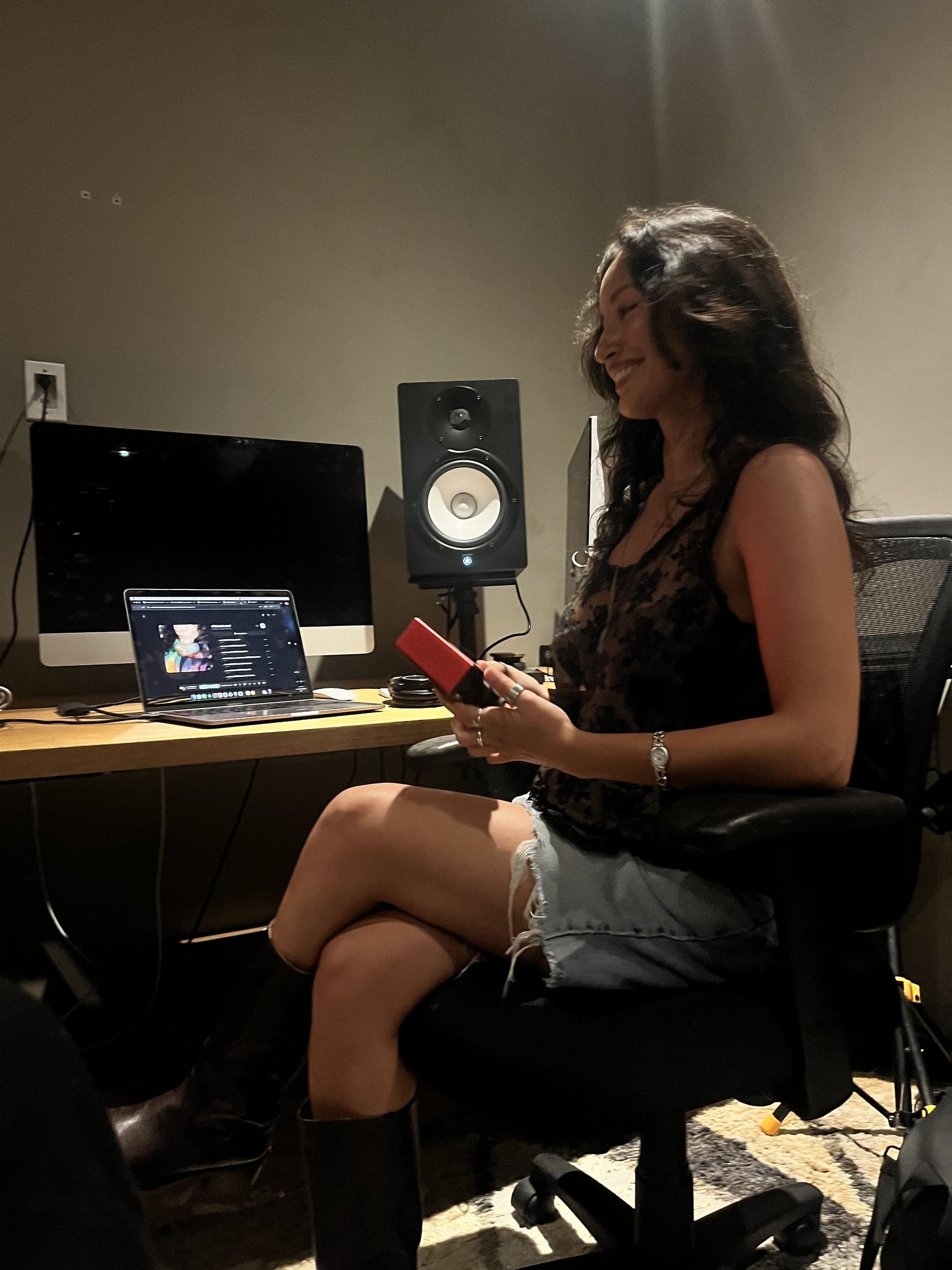christa guzmán smiling in the studio